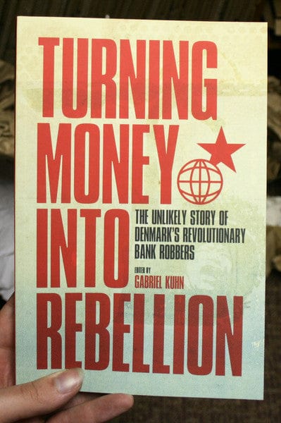 PM Press Books > True Crime & Conspiracy > True Crime Turning Money into Rebellion: The Unlikely Story of Denmark's Revolutionary Bank Robbers - Book 9781604863161 MC-20574