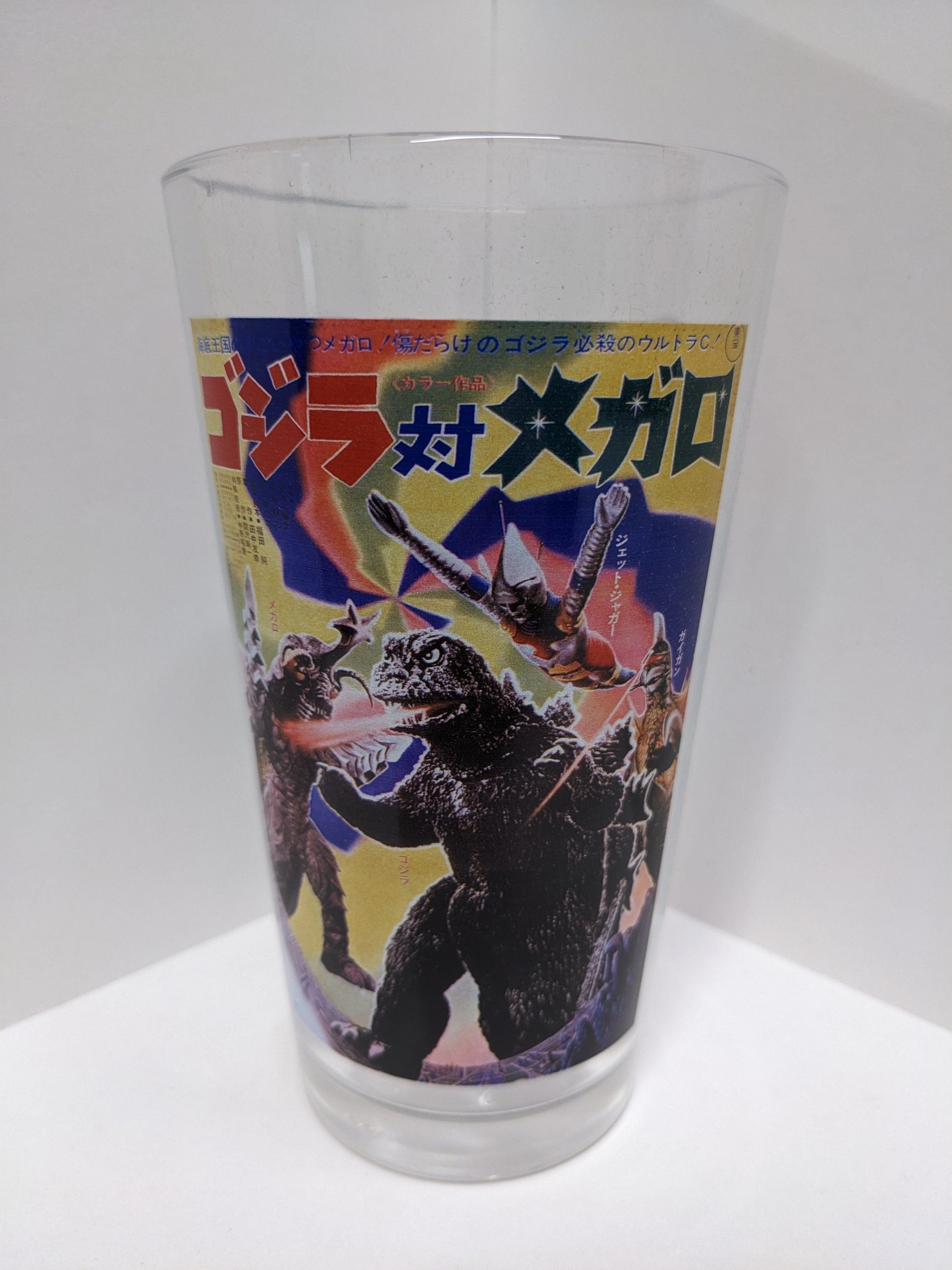 Popfun Home > Drinkware Toon Tumblers: Toho - Godzilla vs. Megalon 01082108